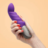 Curved Purple vibrator with soft silicone, and a great handle with buttons - for internal use and Gspot stimulation. Hand holding device with red nail polish